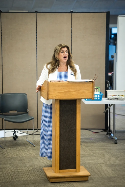 A female teacher presenting information to a breakout session that came to the conference. 