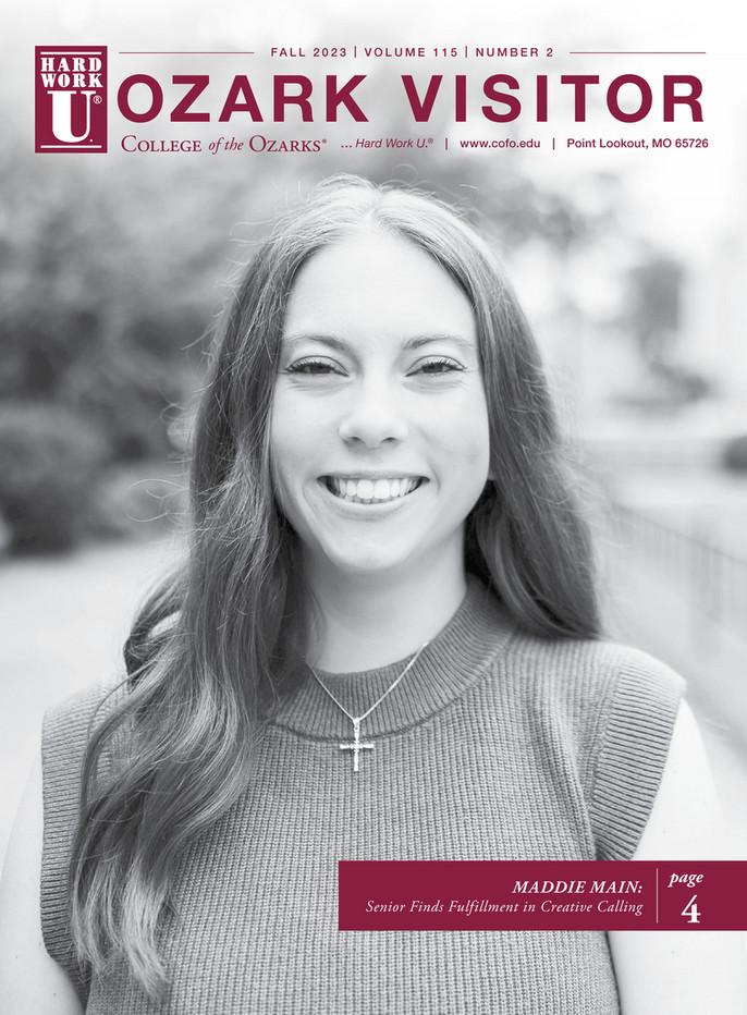 Smiling young lady wearing a cross necklace. 