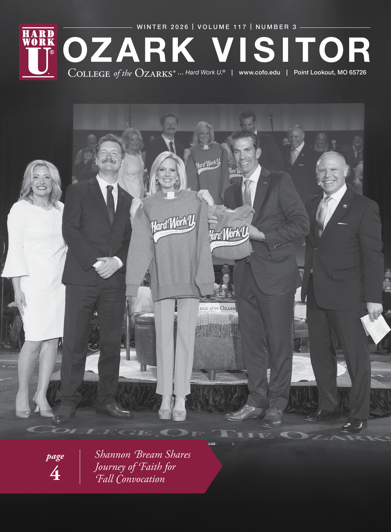 A group of people standing on the C of O stage.