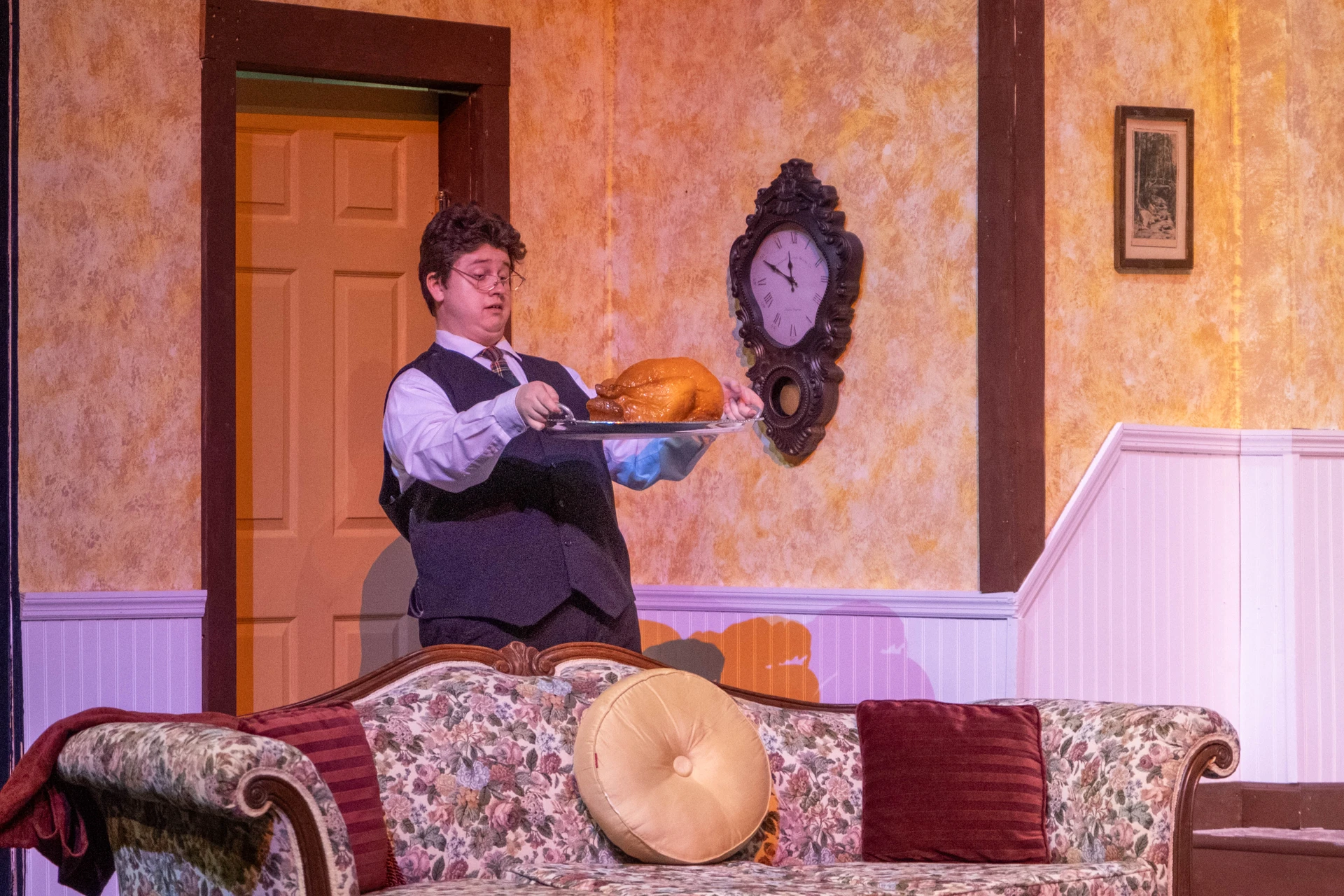  Louis AuClaire carries a turkey.
