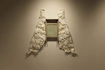 Marianne Lattieri Washboard Wings, 2020, Vintage gloves, canvas, wire, thread.