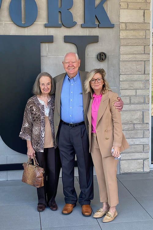 Ernie and Carolyn Watson with Dean of Development at the student center