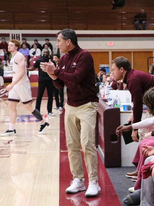 Coach Shepherd cheering for the team
