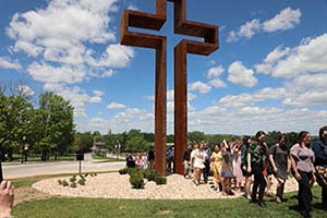 Seniors walk through Empty Cross.

