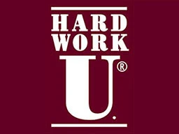 A logo for a college campus with maroon background and white lettering 