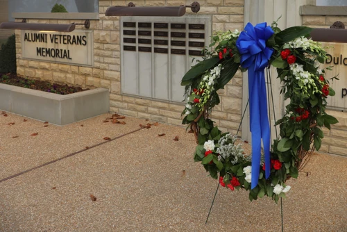 Wreath displayed at Alumni Veterans Memorial to honor S of O and C of O alumni who made the ultimate sacrifice 