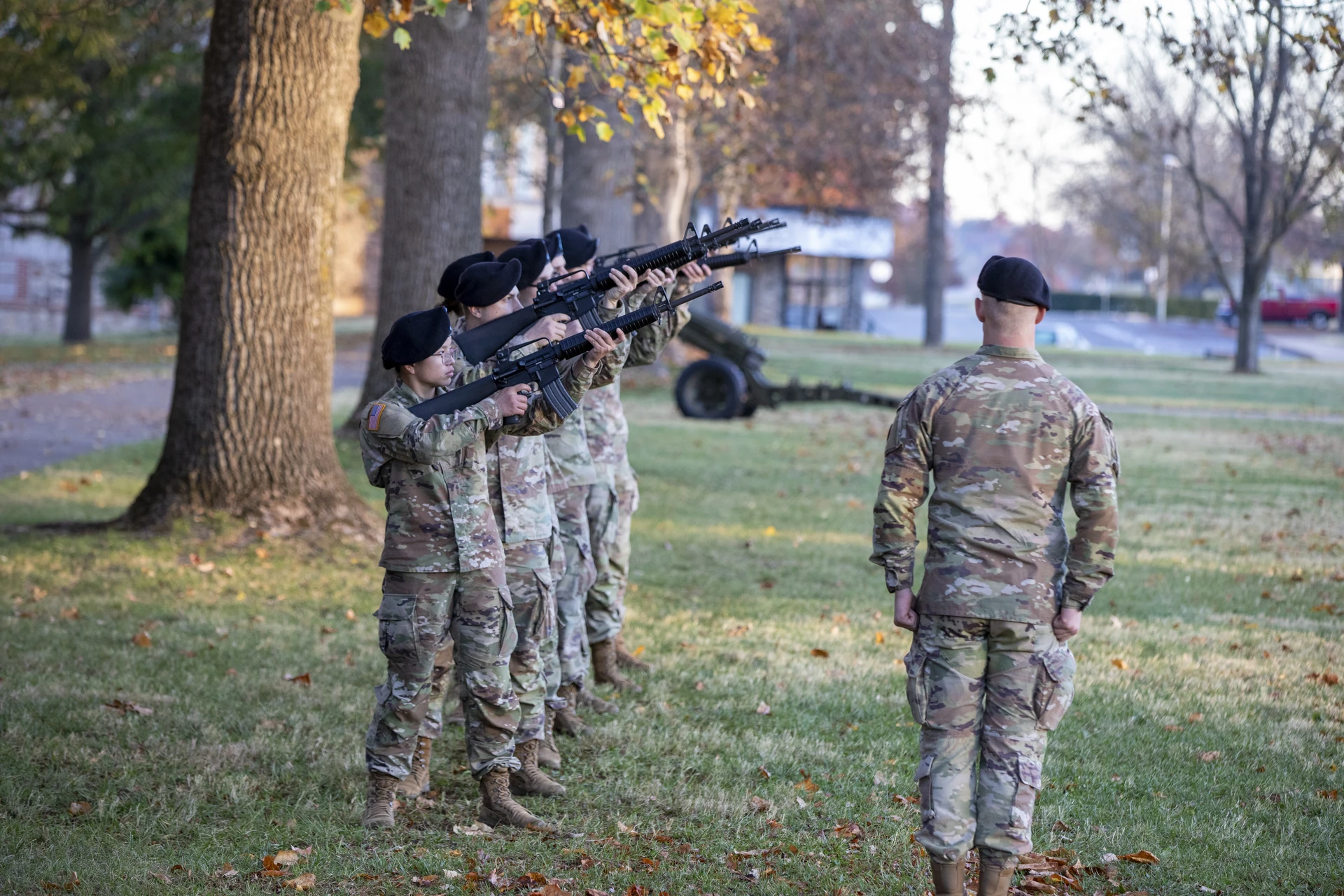 men firing guns