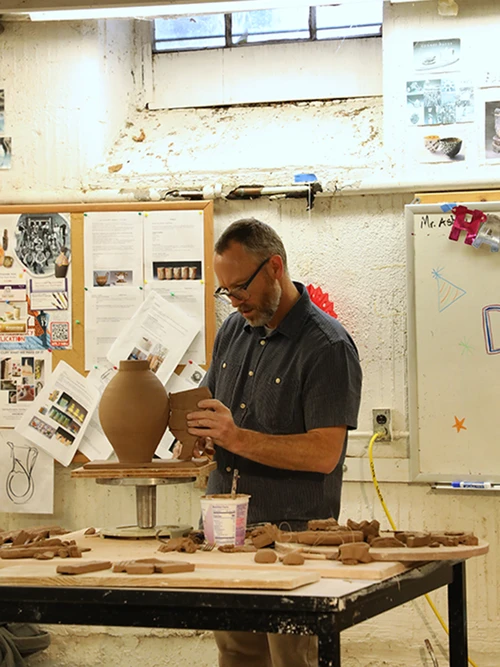 Wells leads a ceramics workshop for College of the Ozarks art students.