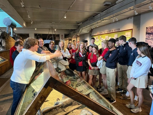 Man showing students museum