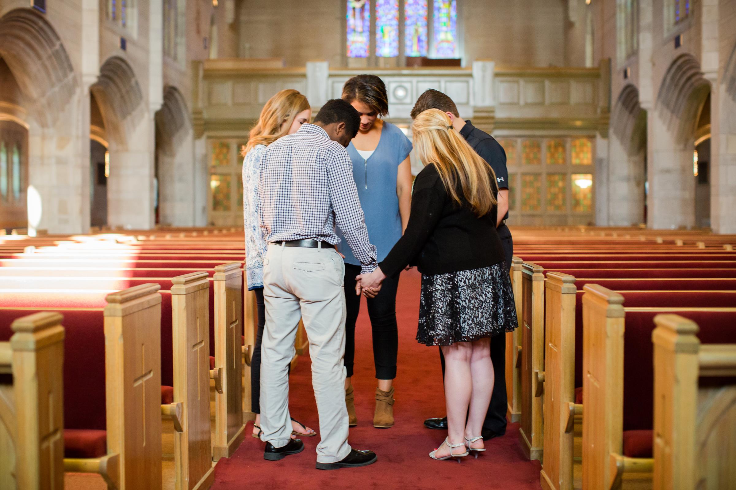 Students praying together in the chapel.