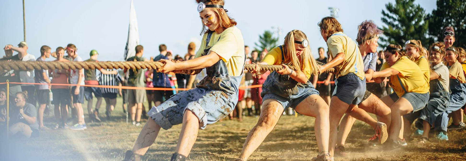 Student pulling at Mudfest tug of war