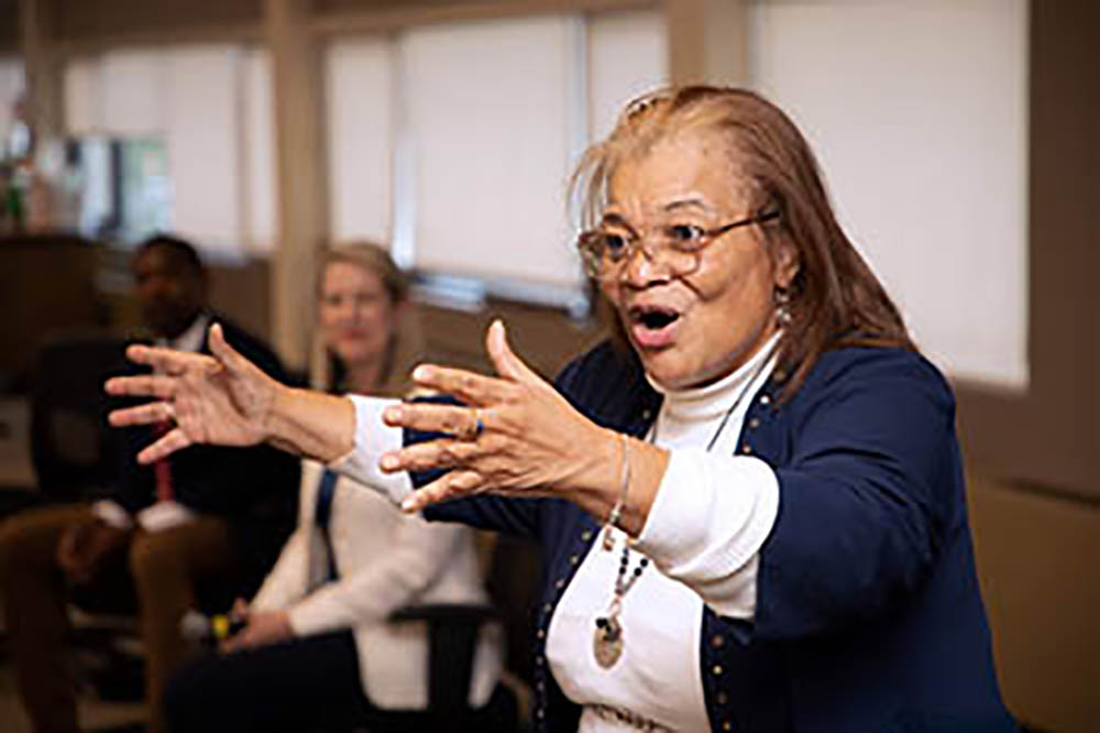 woman speaking to students