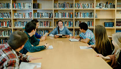 Students at a conference table