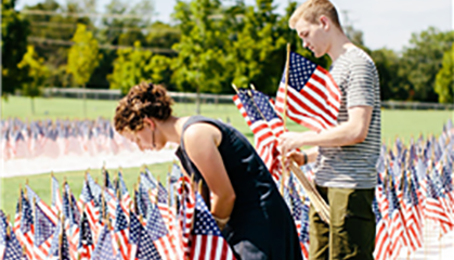Students placing flags in memorial of 9-11.