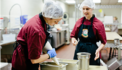 Student and supervisor in kitchen