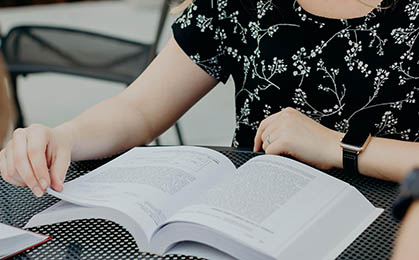 Reading a book and flipping through pages