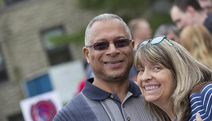 Two people smiling at the camera.