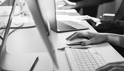 computers with hands on keyboards.
