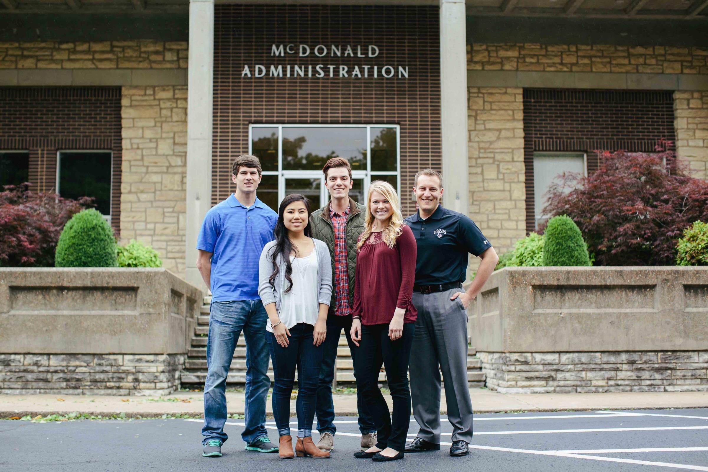 Admissions Office Workers standing out front McDonald Administration building