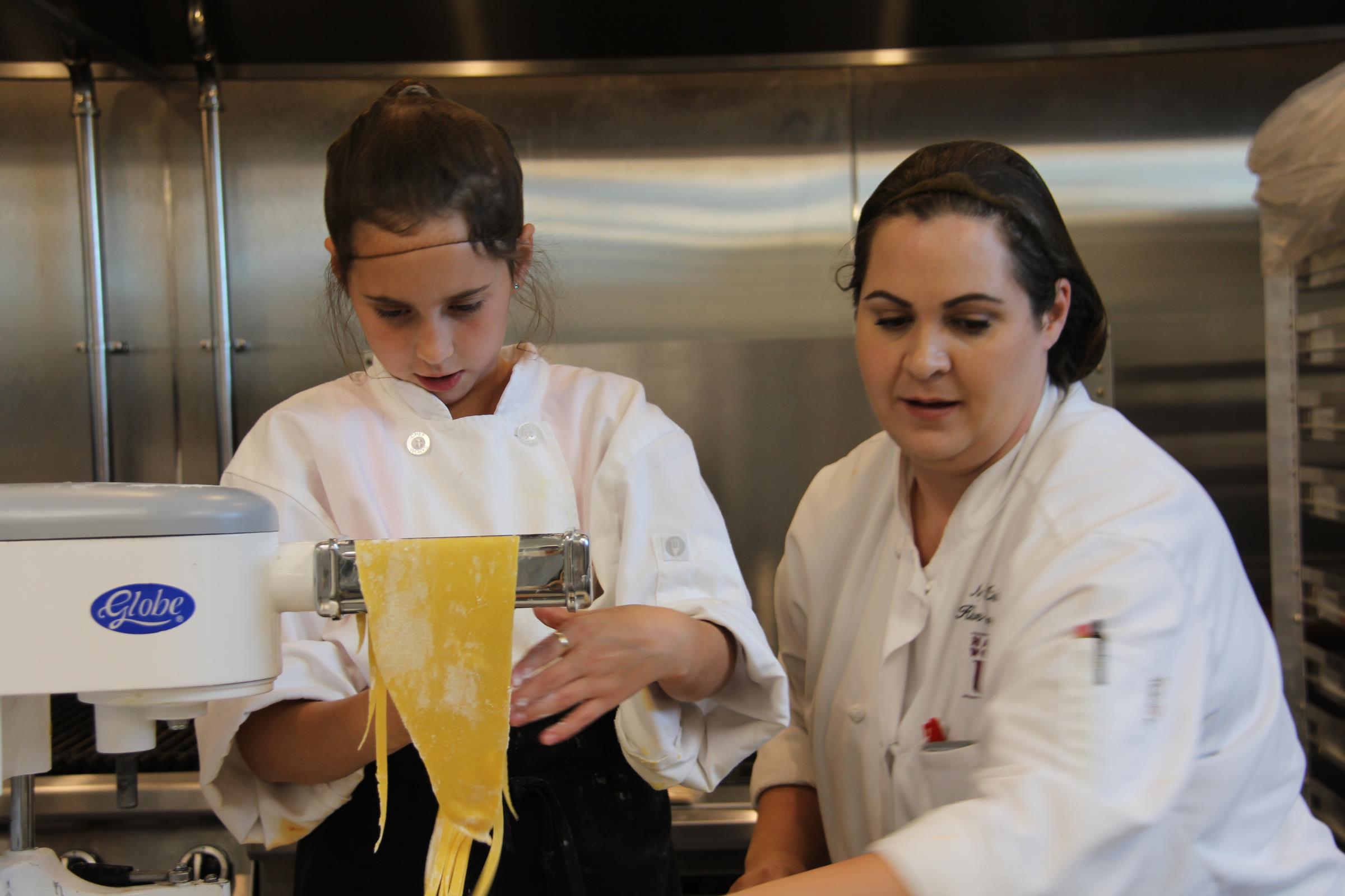Student Worker working with her supervisor in the Keeter Center Kitchen