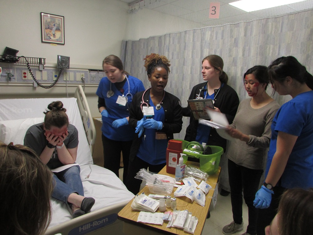 Students working on another's health