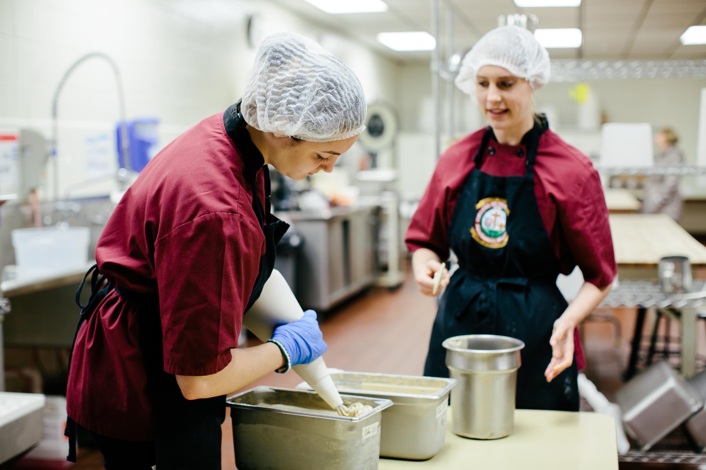 Two Students working in the Fruitcake and Jelly Kitchen