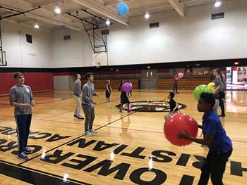 S of O students with children in gymnasium