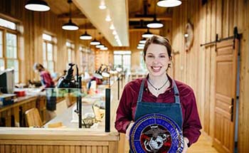Student in Stained Glass and Candle Shop