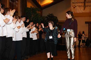 Tiffany Adams receives a warm welcome as she walks the red carpet at The Keeter Center, accompanied by her buddy, Rachel Haynes, senior history major.