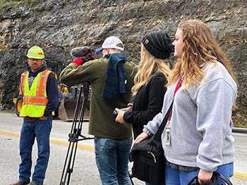 Ethan Harrison, Junior video production major, Savannah Hampton, senior journalism major, and Avery Reed, junior journalism major, film a piece for "The Point."