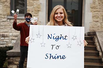 Alicia House, junior biblical and theological studies major and student leader at Christian Ministries, prepares signs for guests at Night to Shine, a prom night event for people with special needs. College of the Ozarks partners with the Tim Tebow Foundation for the annual event. 
