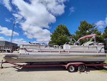 College of the Ozarks displays pontoon boat for annual auction.
