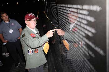 Sgt. Maj. USMC (Ret.) Eddie Neas gives the students an account of his time as a machine gunner with the First Marine Division during the Vietnam War at the national Vietnam Veterans Memorial. 
