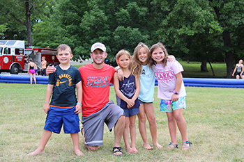 Campers pose with a student counselor at Camp Lookout.
