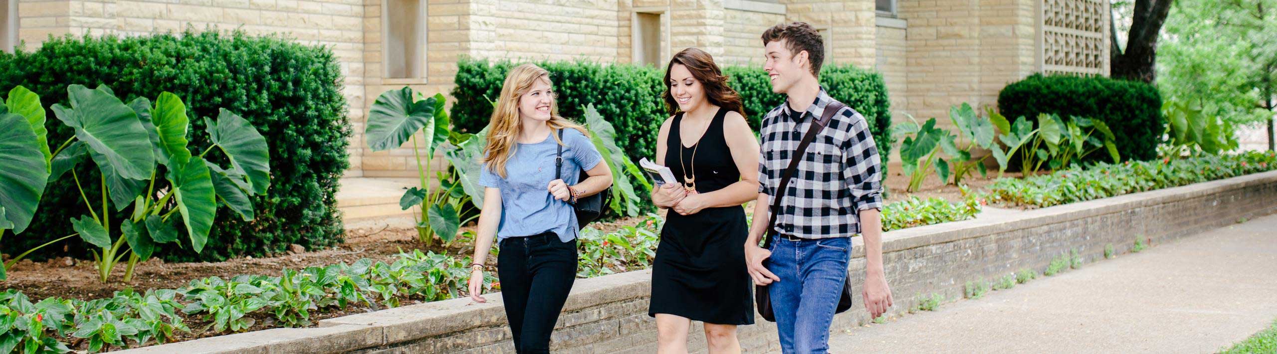 Students walking down the sidewalk